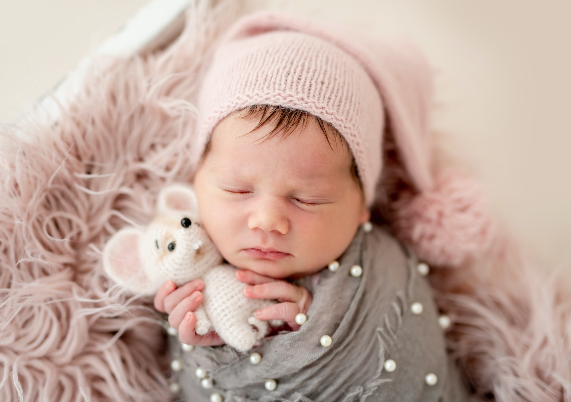 Cute newborn with toy