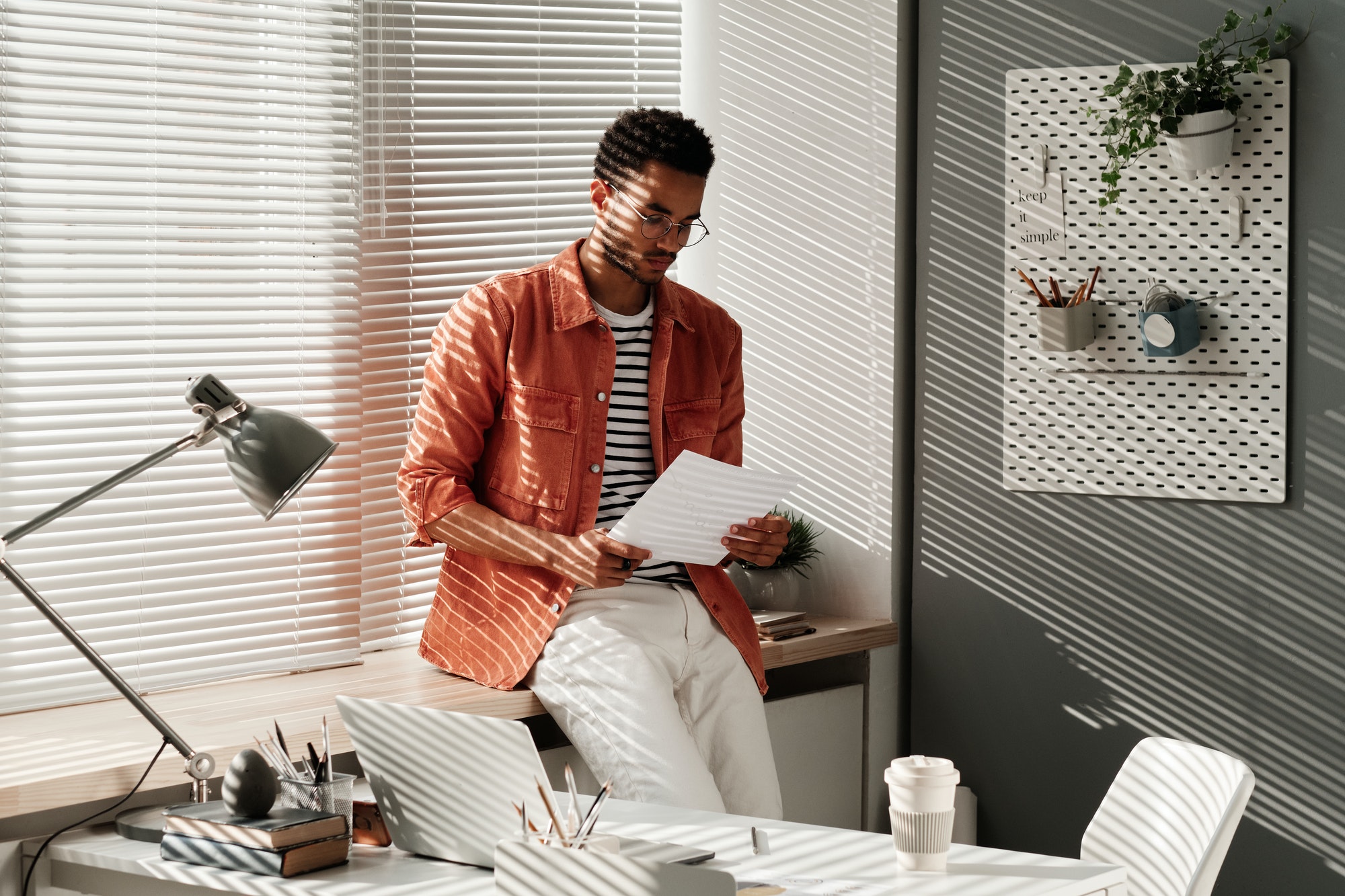 Man in eyeglasses reading document