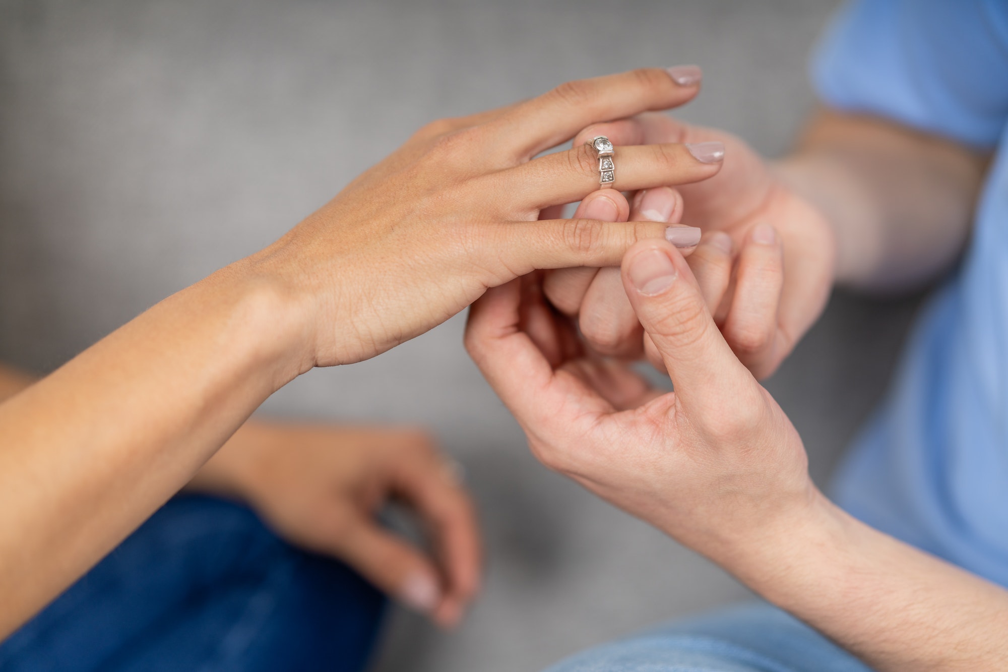 Man proposing marriage with a ring to a woman